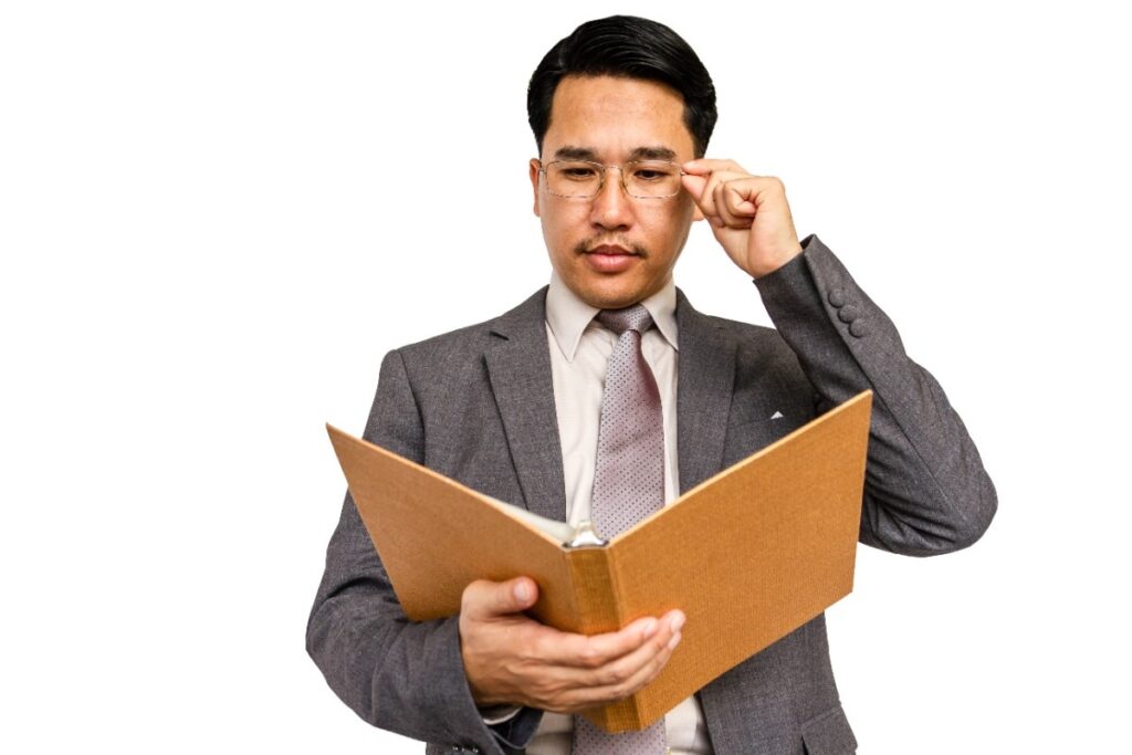 Businessman holding file folder on a white background