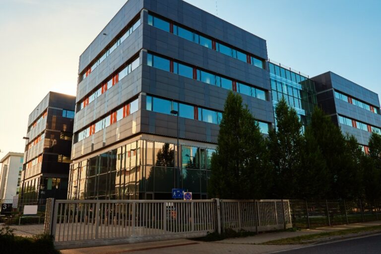 Modern office building with green trees