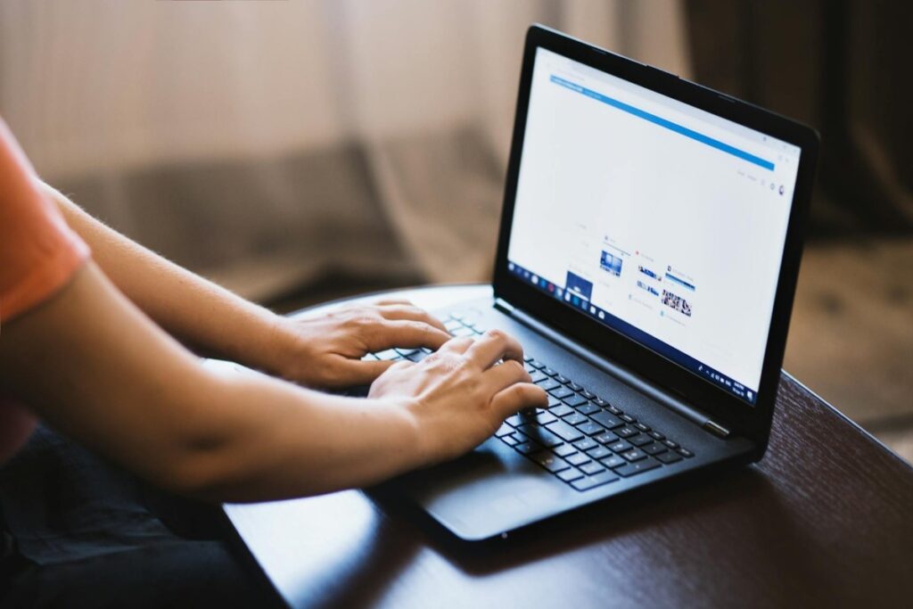 Open laptop with social media profile on it