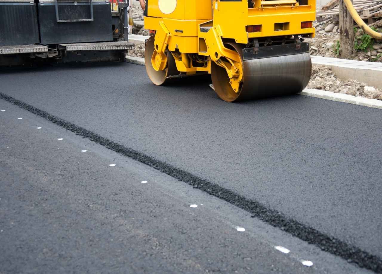 Aphalt being compacted by roller