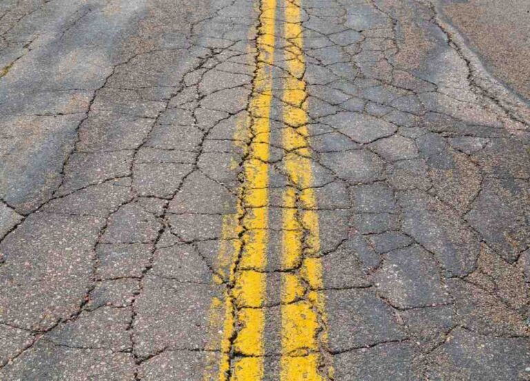 asphalt with yellow double lines cracked