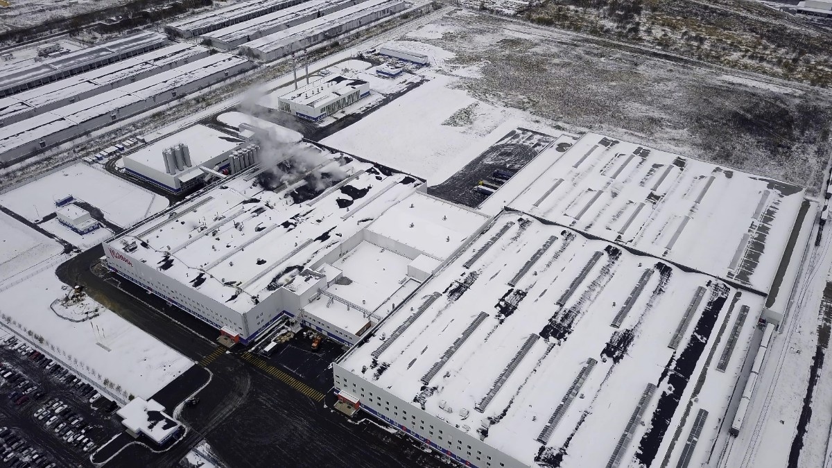 Winter view from the drone to the factory covered in snow
