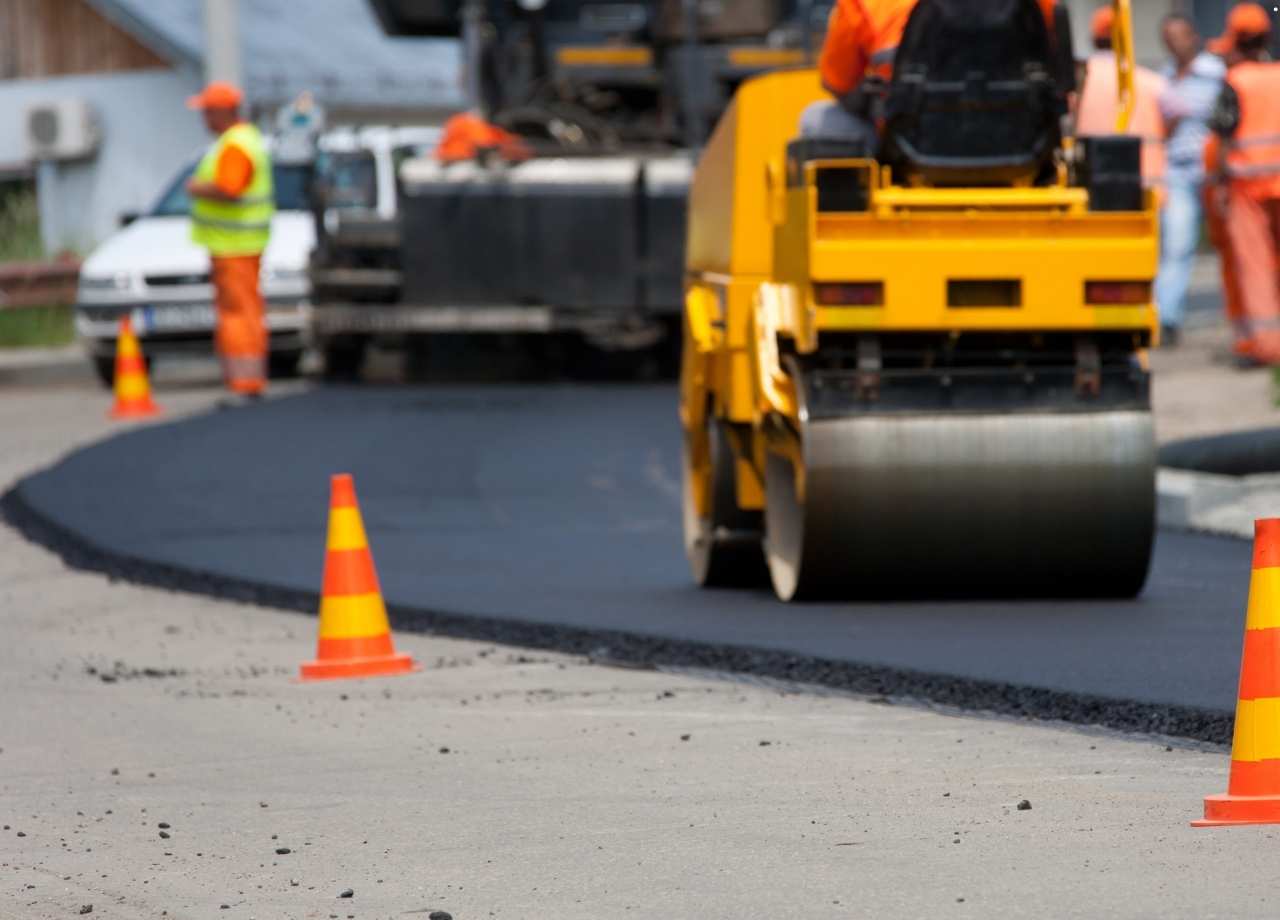 asphalt concrete being layed by machine