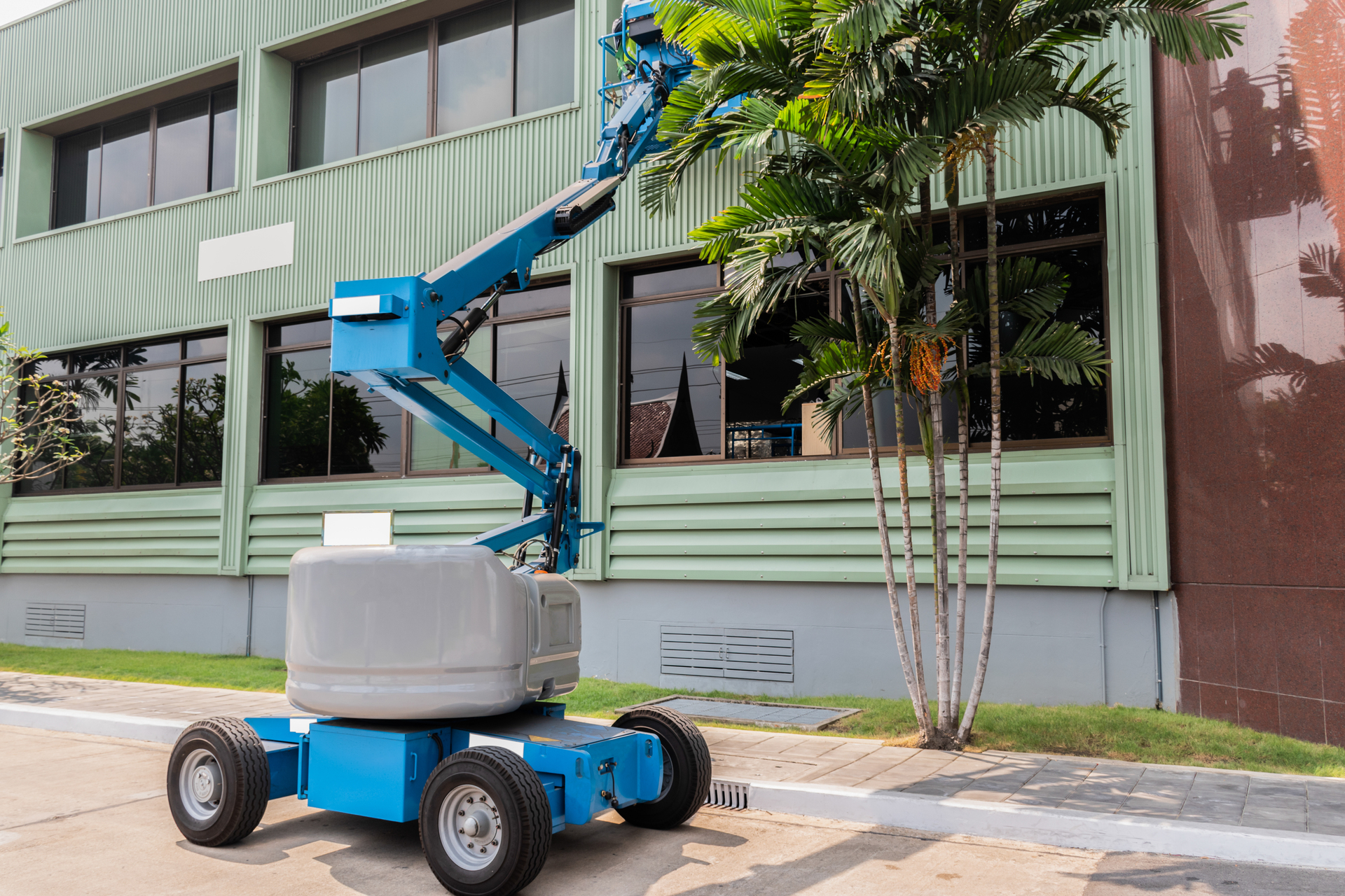 truck mounted platfom beside commercial offices