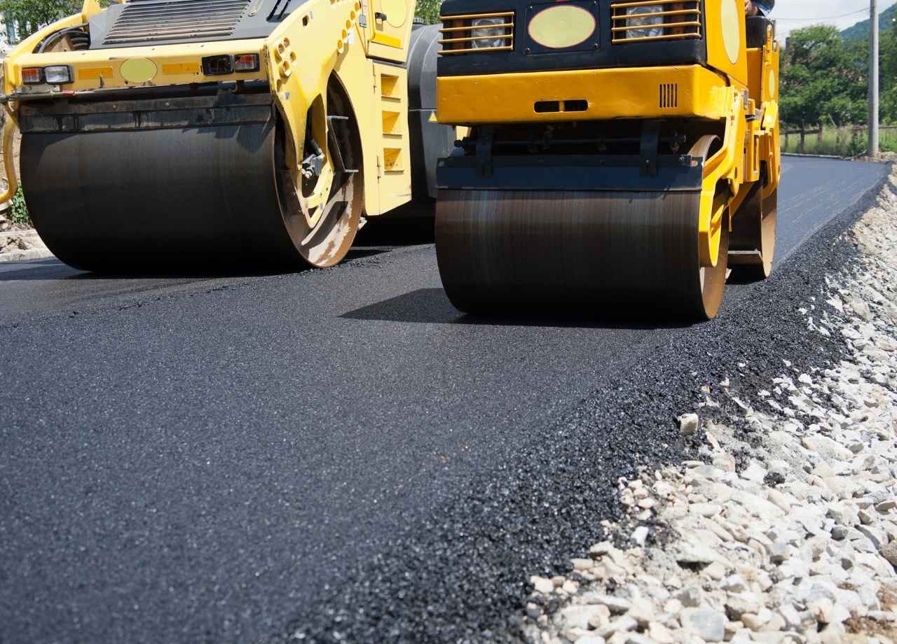 two tar rollers compacting recentyl laid asphalt 