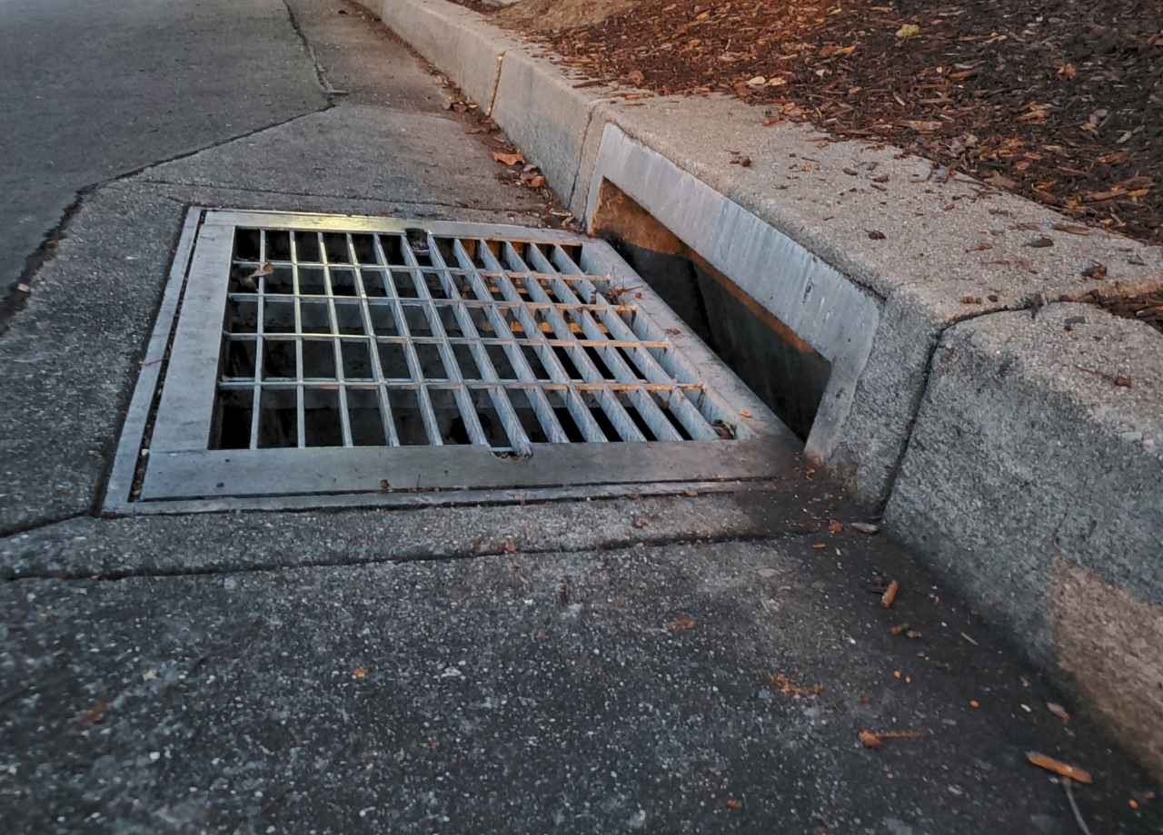 Drainage vent on the side of asphalt road