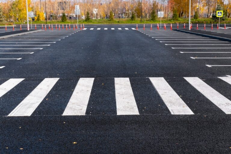 freshly laid asphalt showing lot crosswalk and markings