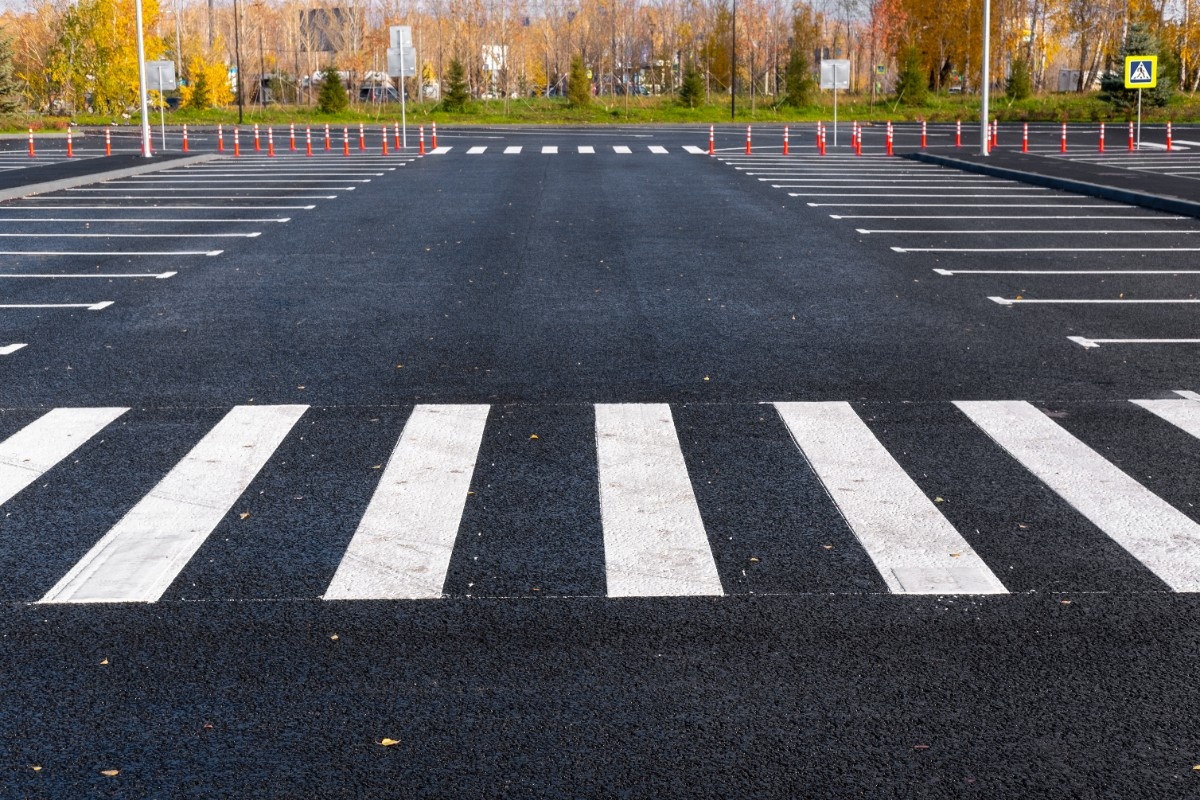 freshly laid asphalt showing lot crosswalk and markings