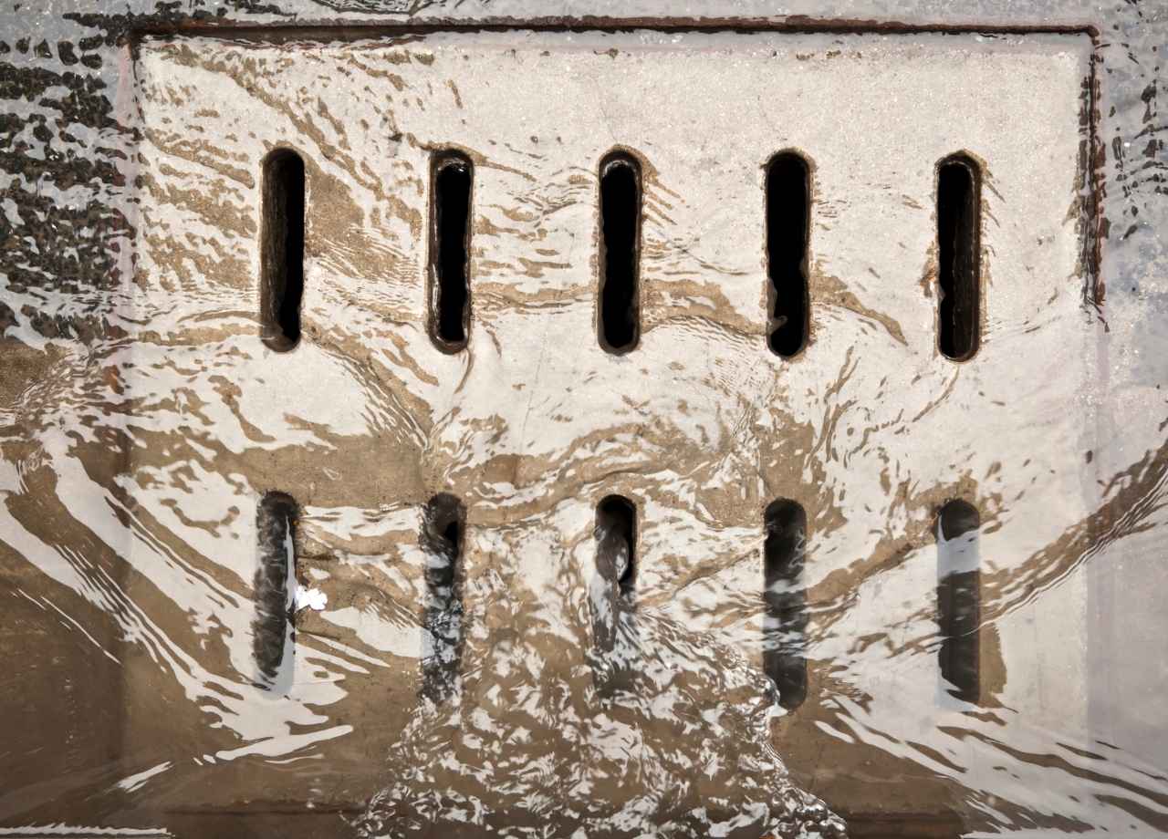 Catch basin with water flowing into it