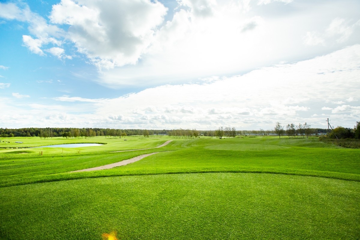 beautiful green golf course and blue sky