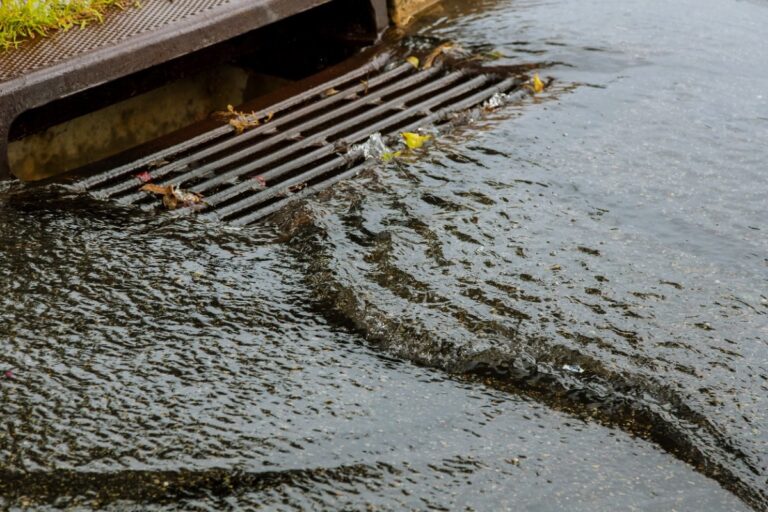 Water gushing flowing into storm sewer
