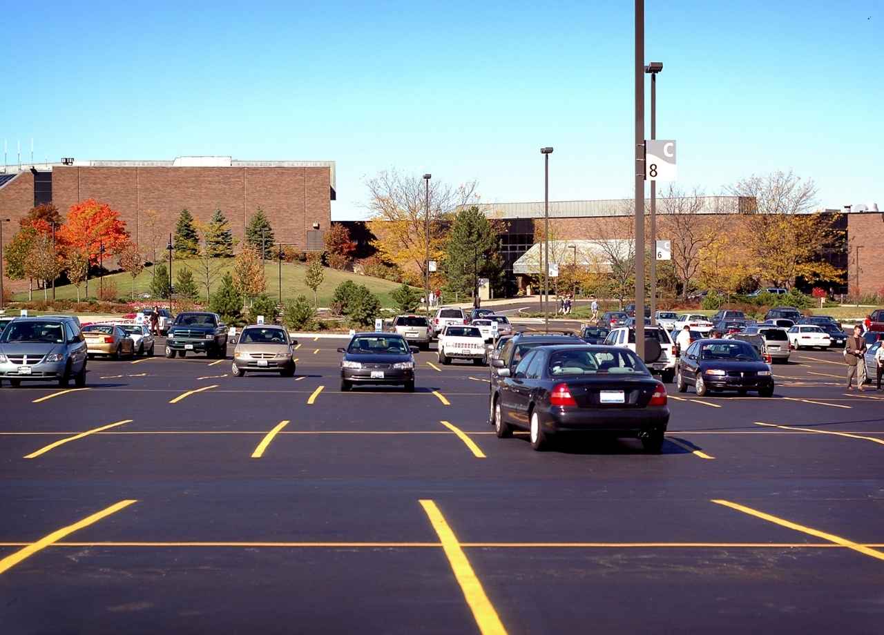 commercial parking lot with plenty of cars