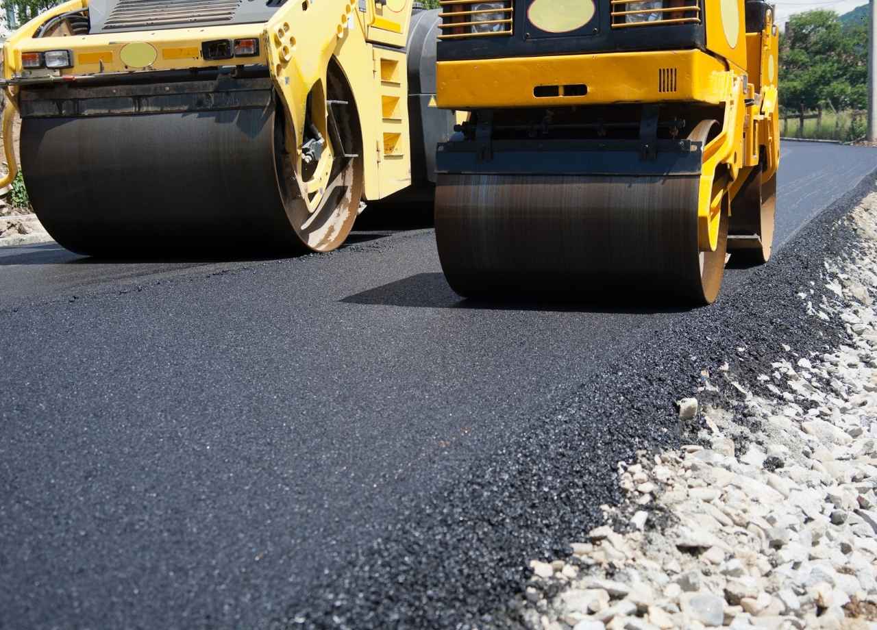 two rollers compressing asphalt