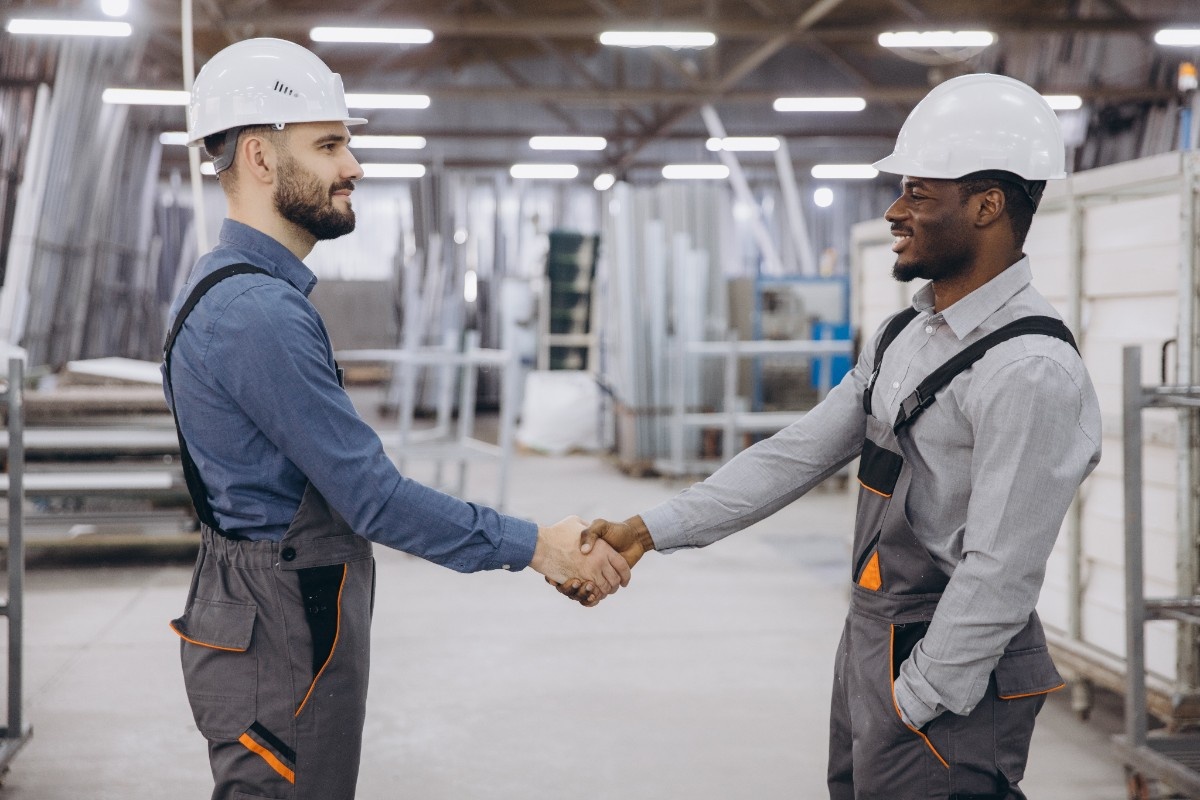 engineers-shaking-hands-in-windows-and-doors storage area