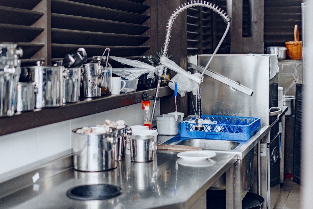 
clean-outside-restaraunt-kitchen-full-of-dishes-