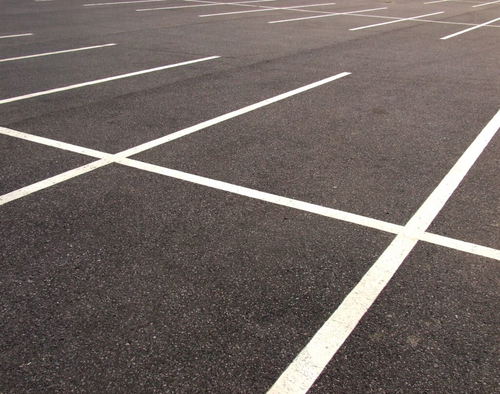 A freshly paved and striped parking lot