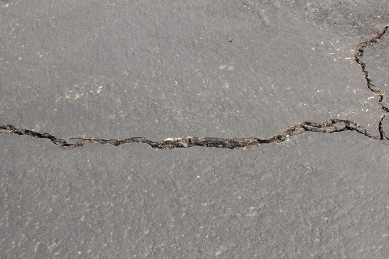 cracked and damaged parking lot,road or driveway need for repairing
