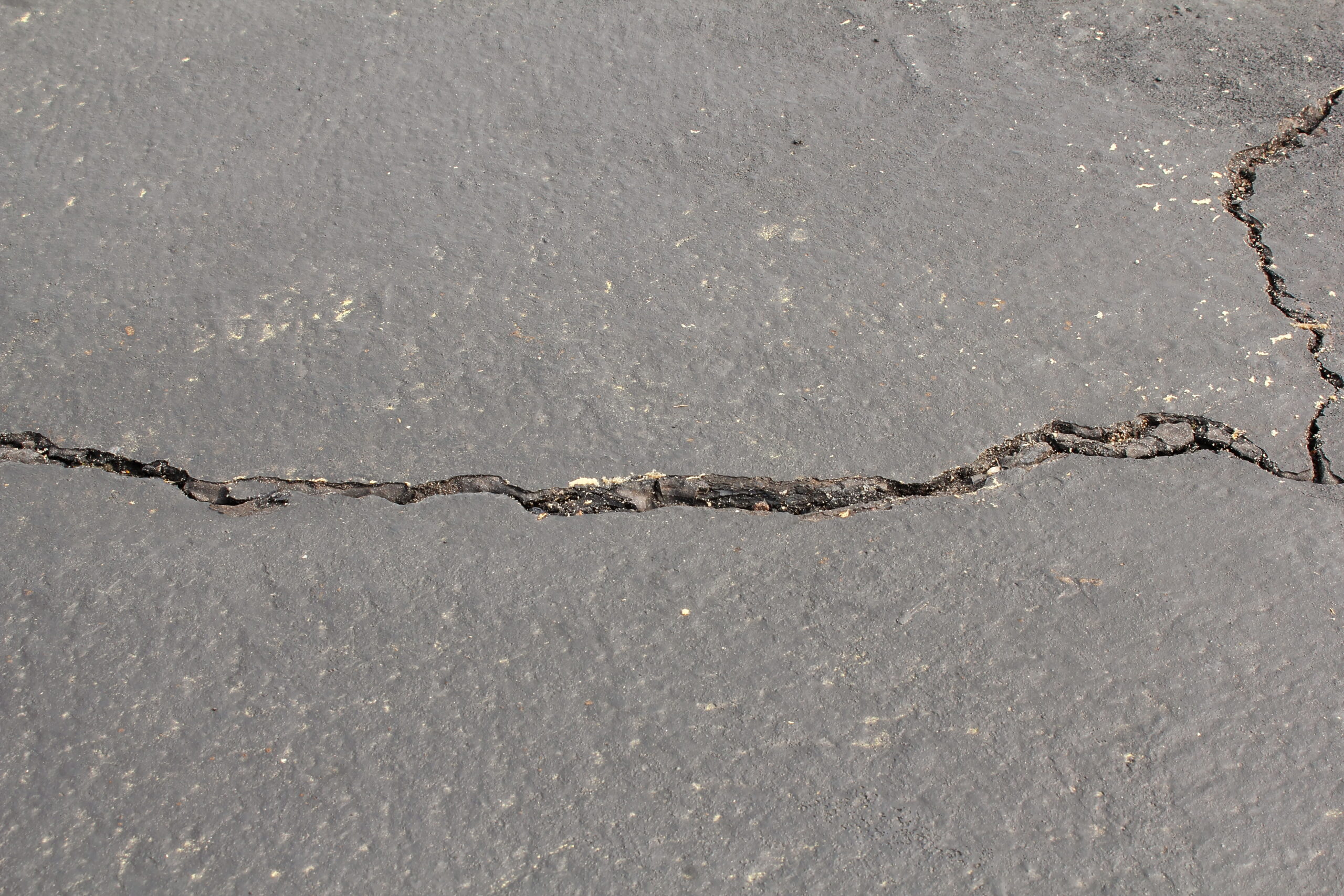 cracked and damaged parking lot,road or driveway need for repairing