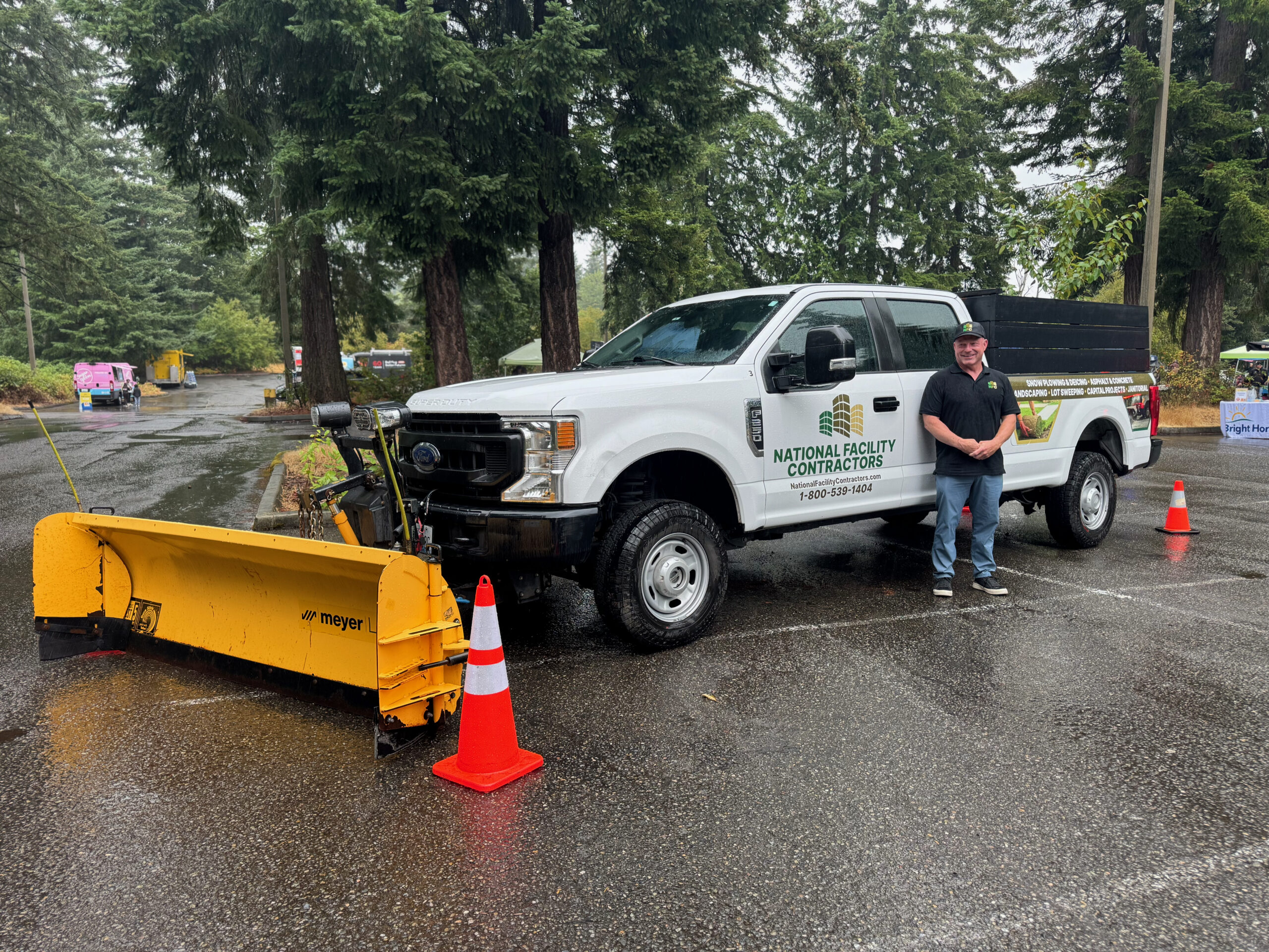 A snow plow truck sits in the parking lot of the Bright Horizons Truck Day 2026 event at Bellevue College